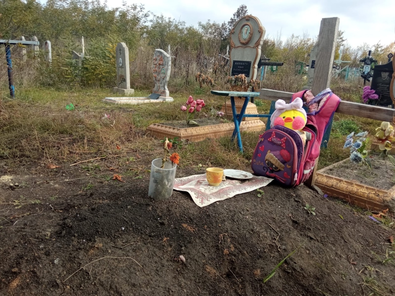 10-year-old Katya Vinarska's grave, in Kharkiv Oblast. The Kharkiv Oblast's police took the photo before her body's exhumation on Oct. 22, 2022. to get evidence of her killing by a Russian bullet at the beginning of the invasion. (Kharkiv Oblast Police)