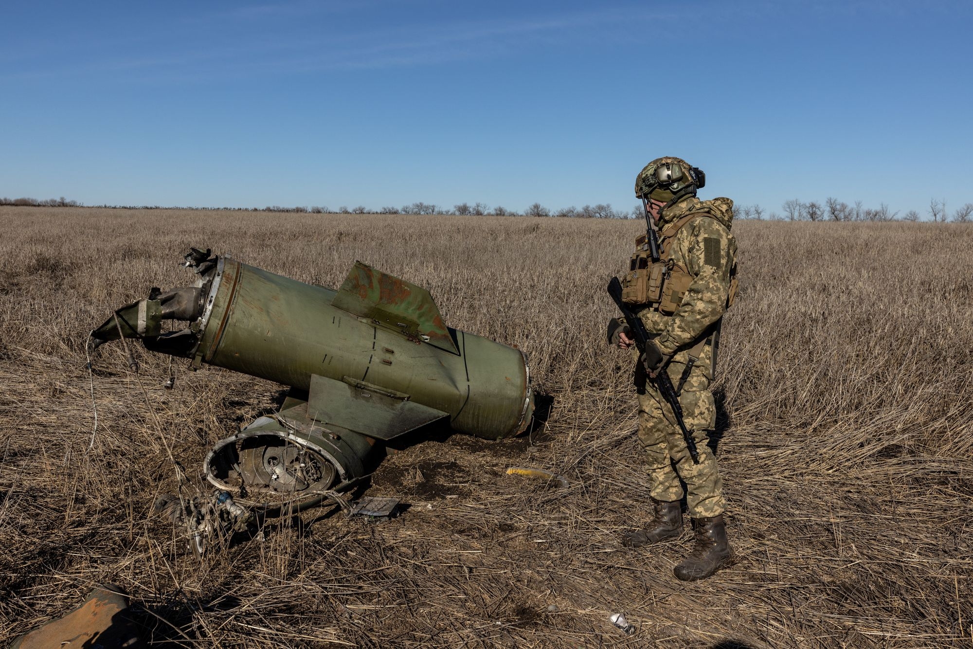 A Ukrainian soldier stands near the wreckage of an S-300 missile in Chasiv Yar, Ukraine, on March 6, 2023. A Ukrainian soldier stands near the wreckage of an S-300 missile in Chasiv Yar, Ukraine, on March 6, 2023.