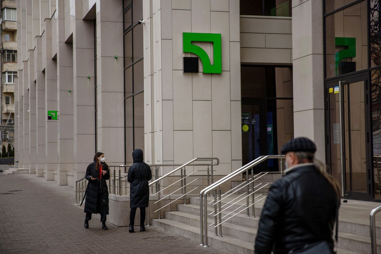 Customers approach a PrivatBank CJSC branch in Kyiv, Ukraine