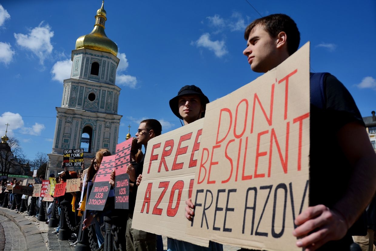 Activists and relatives of Ukrainian prisoners of war hold banners urging for the return of Ukrainian soldiers 