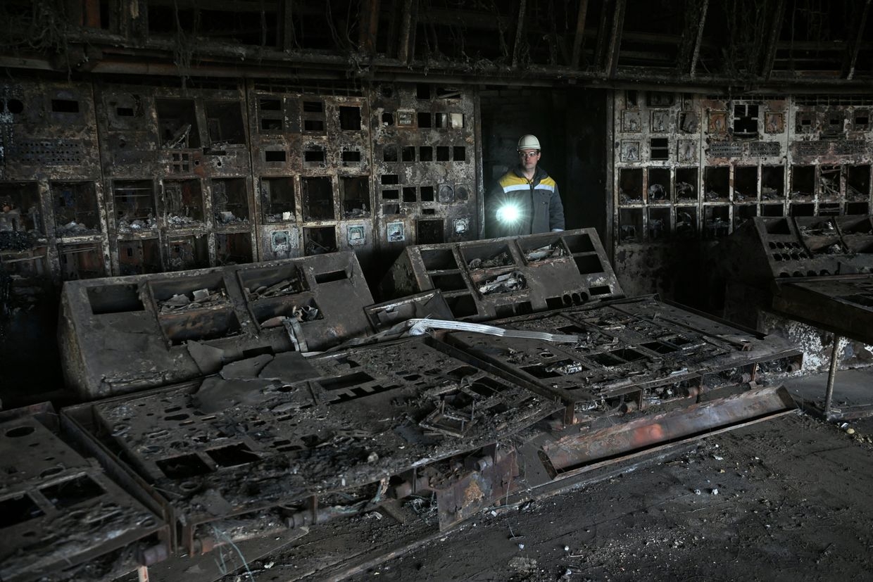 An energy worker walks through a destroyed control room at a DTEK power plant in an undisclosed location in Ukraine on April 19, 2024, amid the Russian invasion. 