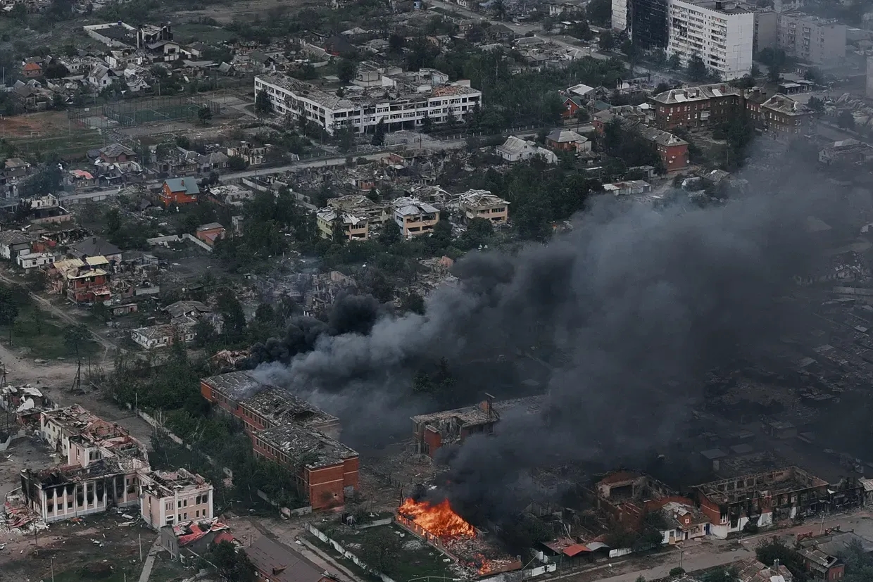 In this aerial view, smoke rises from the Ukrainian border city of in Vovchansk, Ukraine, on May 17, 2024. 