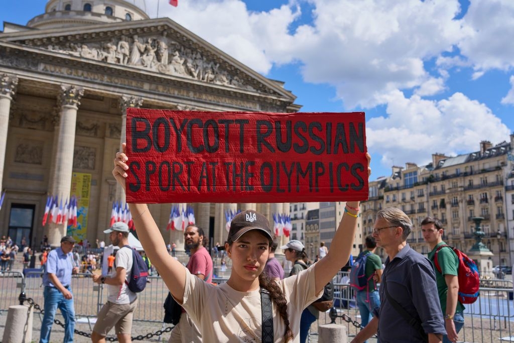 A woman during a march in memory of the hundreds of Ukrainian athletes killed since Russia's full-scale invasion 