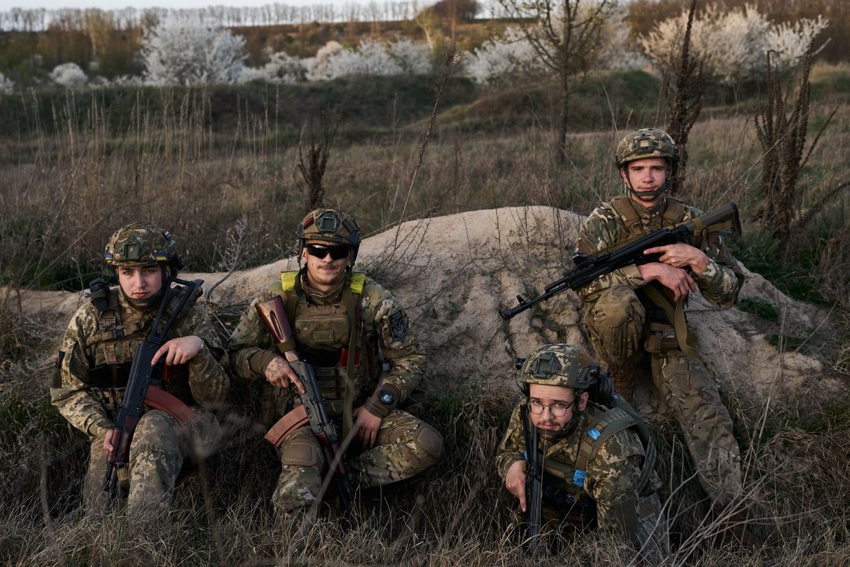 Young soldiers of the "Da Vinci Wolves" battalion pose during orientation training before deployment in Ukraine on Apr. 8, 2024.