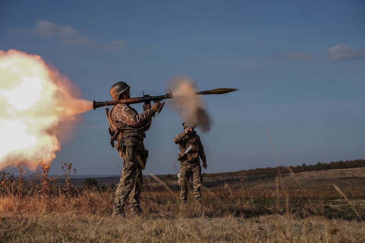 A Ukrainian serviceman from the 56th Brigade fires a grenade launcher during training in Donetsk Oblast, Ukraine, on Oct. 22, 2024.