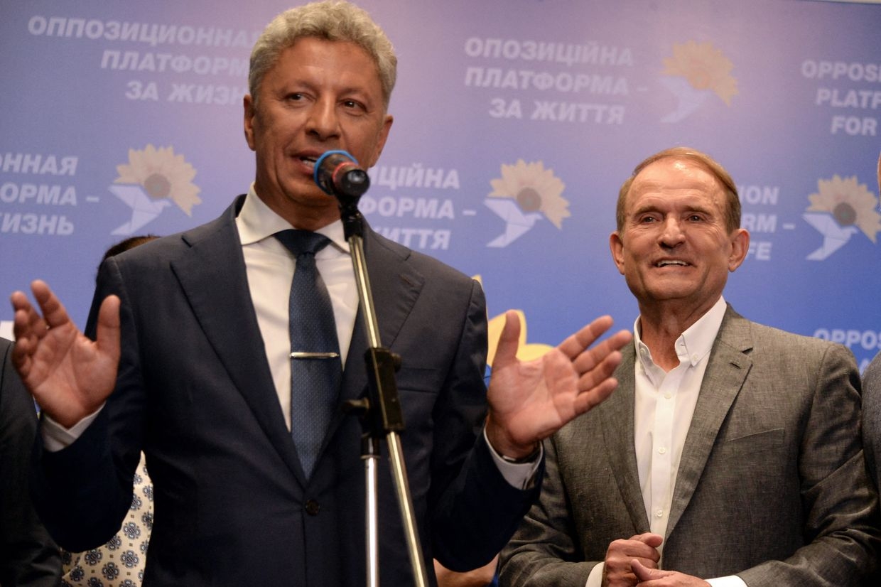 Ukraine's Supreme Court banned party Platform-For Life leaders Viktor Medvedchuk and Yuriy Boyko speak at election HQ in Kyiv, July 21, 2019.