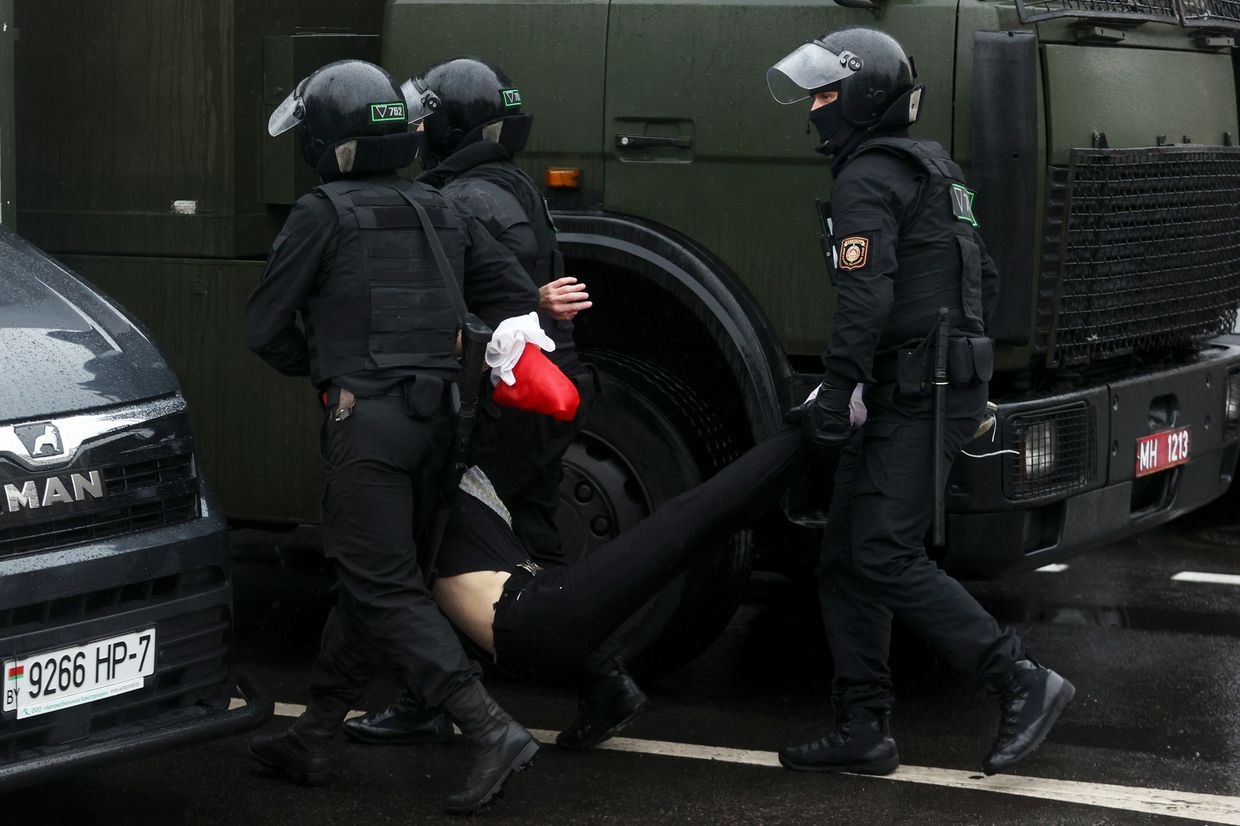  Police detain a man during a protest against Belarus' presidential election results in Minsk, Belarus, on Oct. 11, 2020.