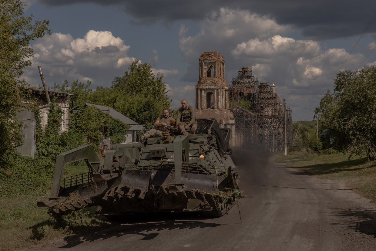 Ukrainian servicemen operate an armored military vehicle on a road near the border with Russia in Sumy Oblast, Ukraine, on Aug. 14, 2024.