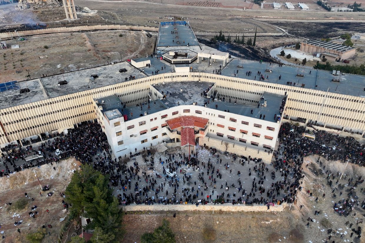 An aerial photo shows people gathering at the Saydnaya prison in Damascus, Syria on Dec. 9, 2024. 