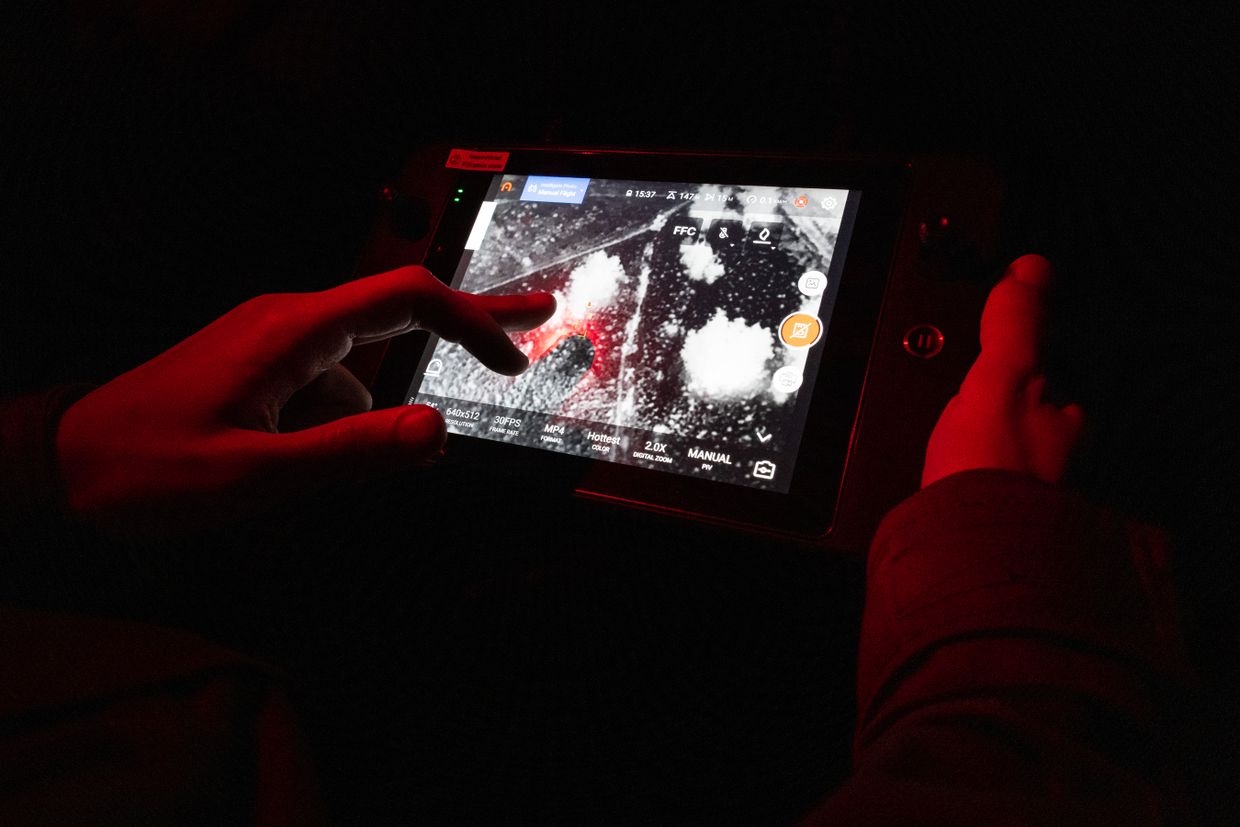 Instructor trains Ukrainian soldiers to fly drones at night using thermal vision in Lviv Oblast, Ukraine, on May 11, 2023. 