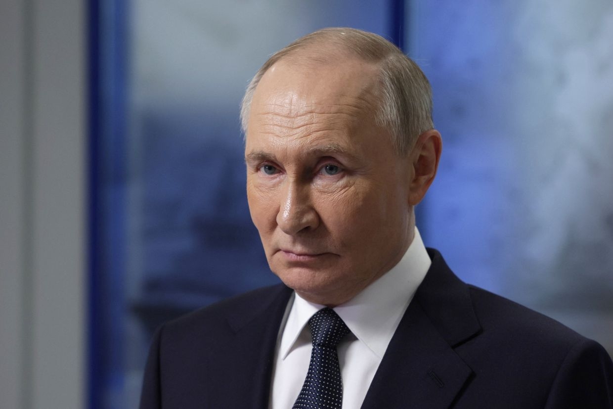 Russia's President Vladimir Putin meets with participants in Arctic expeditions for children organized by Rosatom in Murmansk, Russia, on March 27, 2025. 