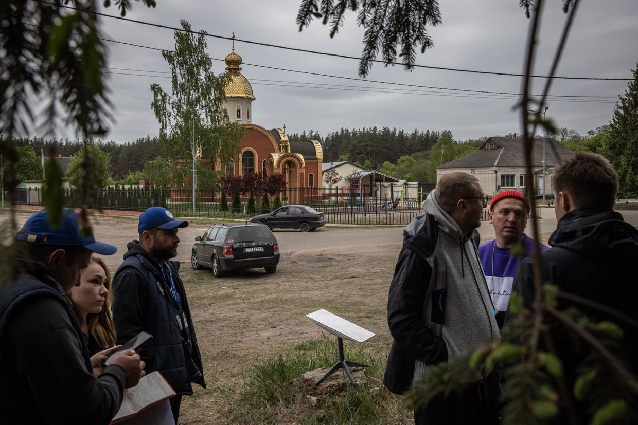A Starlink is seen as evacuees wait in a village to be transported to Kharkiv after being evacuated during a Russian advance into Vovchansk in Kharkiv Oblast, Ukraine, on May 13, 2024. 