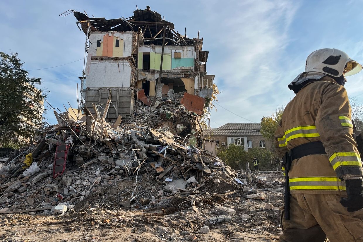 Rescue workers remove rubble of a bombed residential building in Zaporizhzhia, Ukraine, on Nov. 8, 2024. 