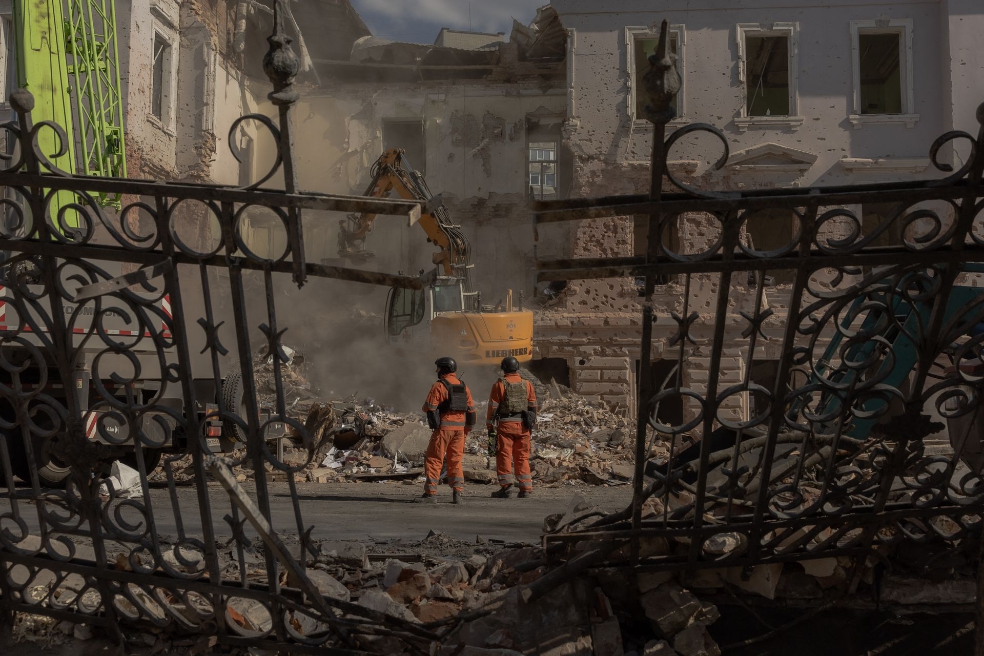 Ukrainian emergency workers search through rubble after a missile strike in Sumy, Ukraine, on April 14, 2025. 