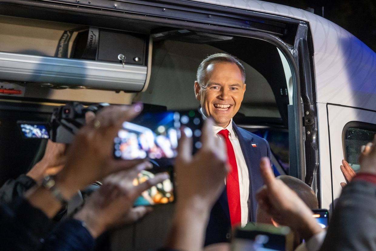 Karol Nawrocki, presidential candidate backed by Poland’s Law and Justice party, greets supporters in Warsaw after a debate on May 12, 2025. 