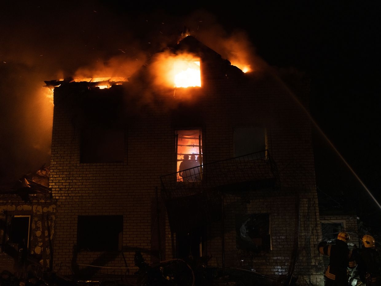 Firefighters extinguish a blaze at a private home in Kharkiv’s Saltivka district after a massive Russian drone attack on April 29, 2025.