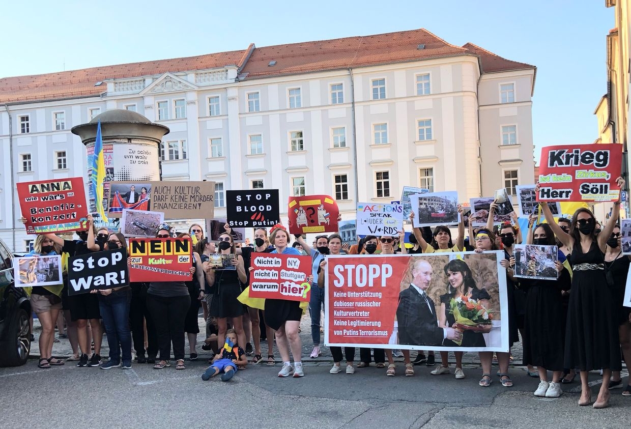 People protest against opera singer Anna Netrebko's appearance at the Schlossfestspiele in Regensburg, Bavaria, Germany, on July 22, 2022. 