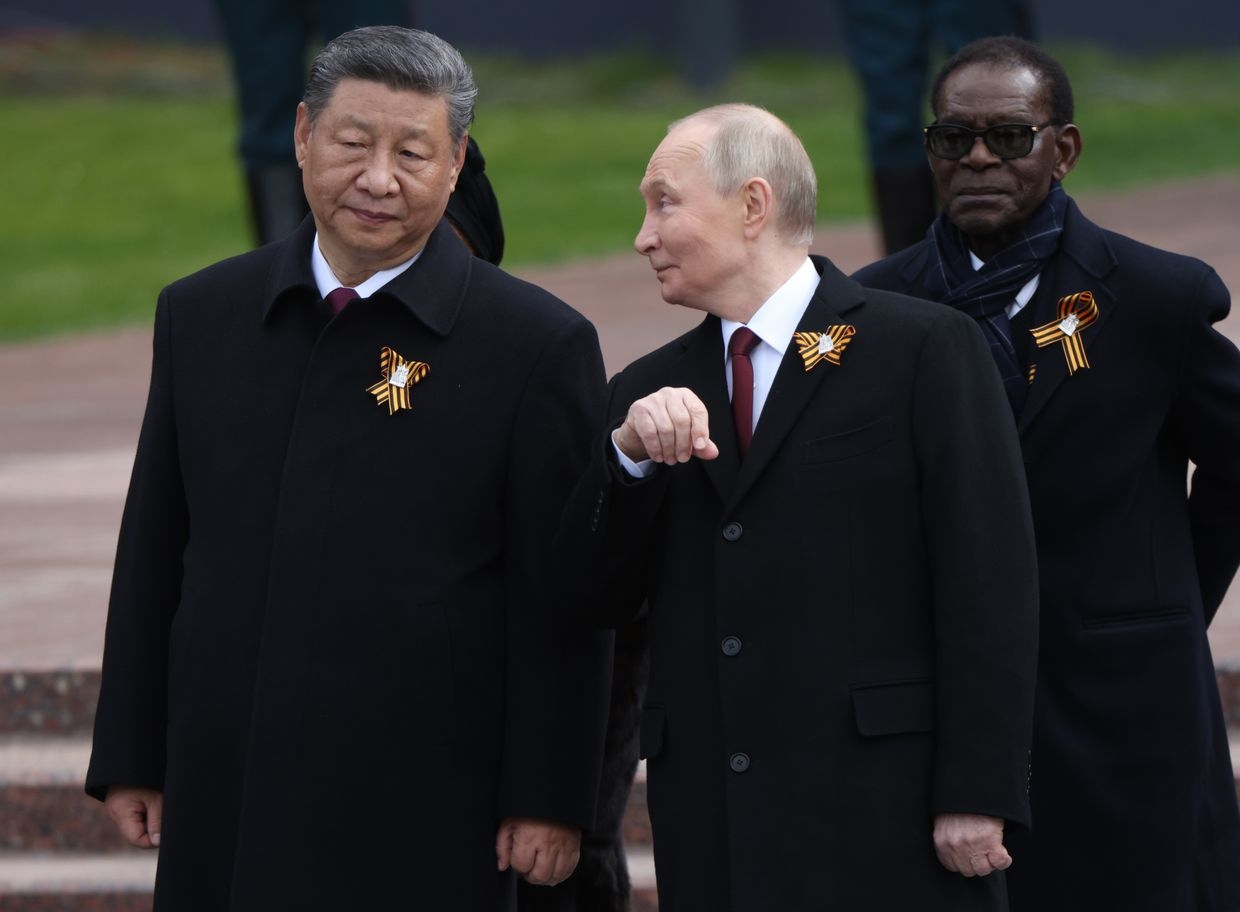 Russian President Vladimir Putin (C) talks to Chinese President Xi Jinping (L) in Moscow, Russia, on May 9, 2025. (Contributor / Getty Images)