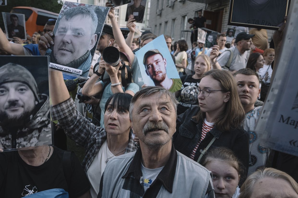 Relatives and military personnel welcome Ukrainian servicemen following a major prisoner-of-war swap with Russia at an undisclosed location in Ukraine, on May 23, 2025. 