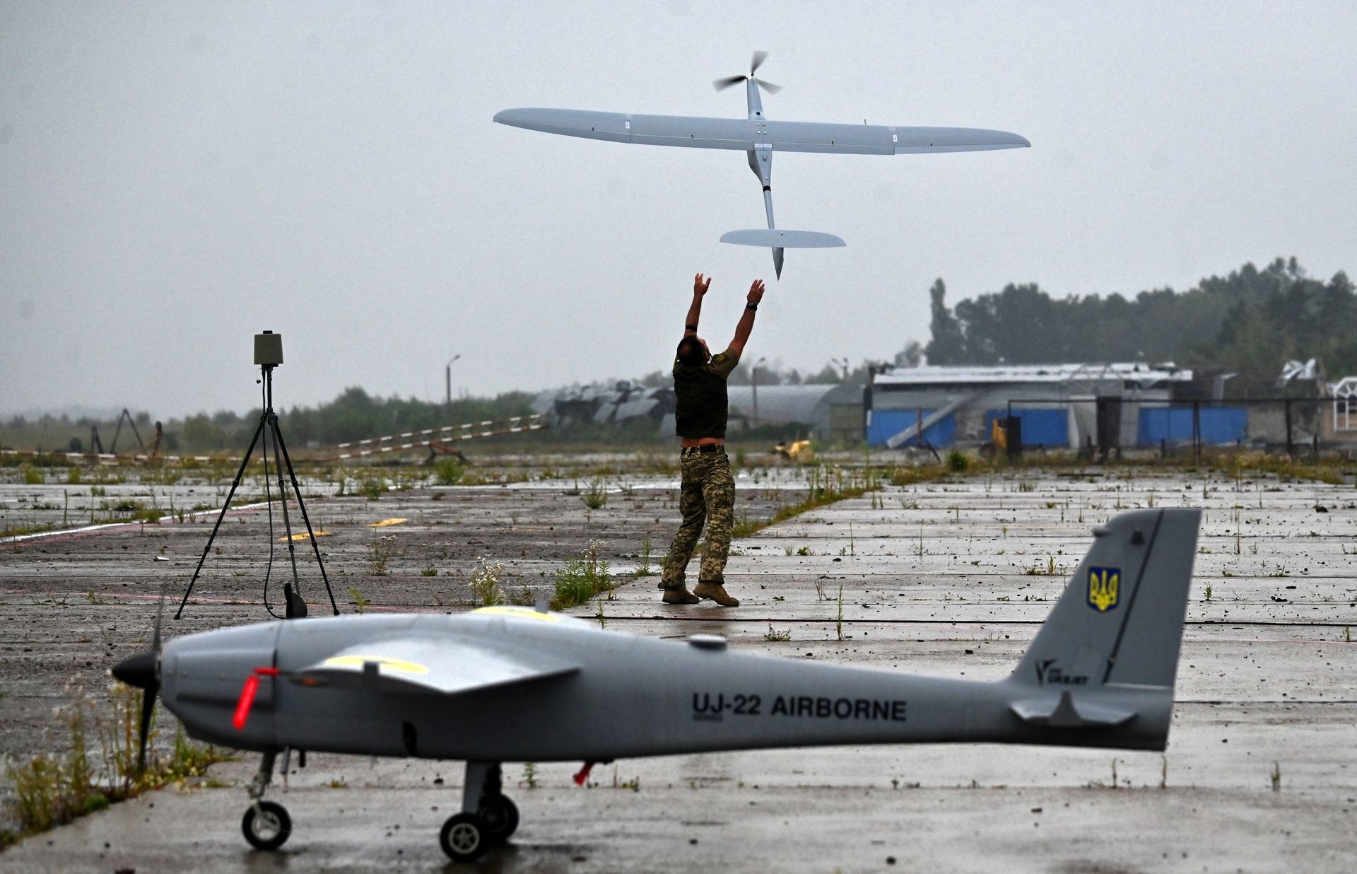 A military operator launches a drone in Kyiv Oblast, Ukraine, on Aug. 2, 2022.