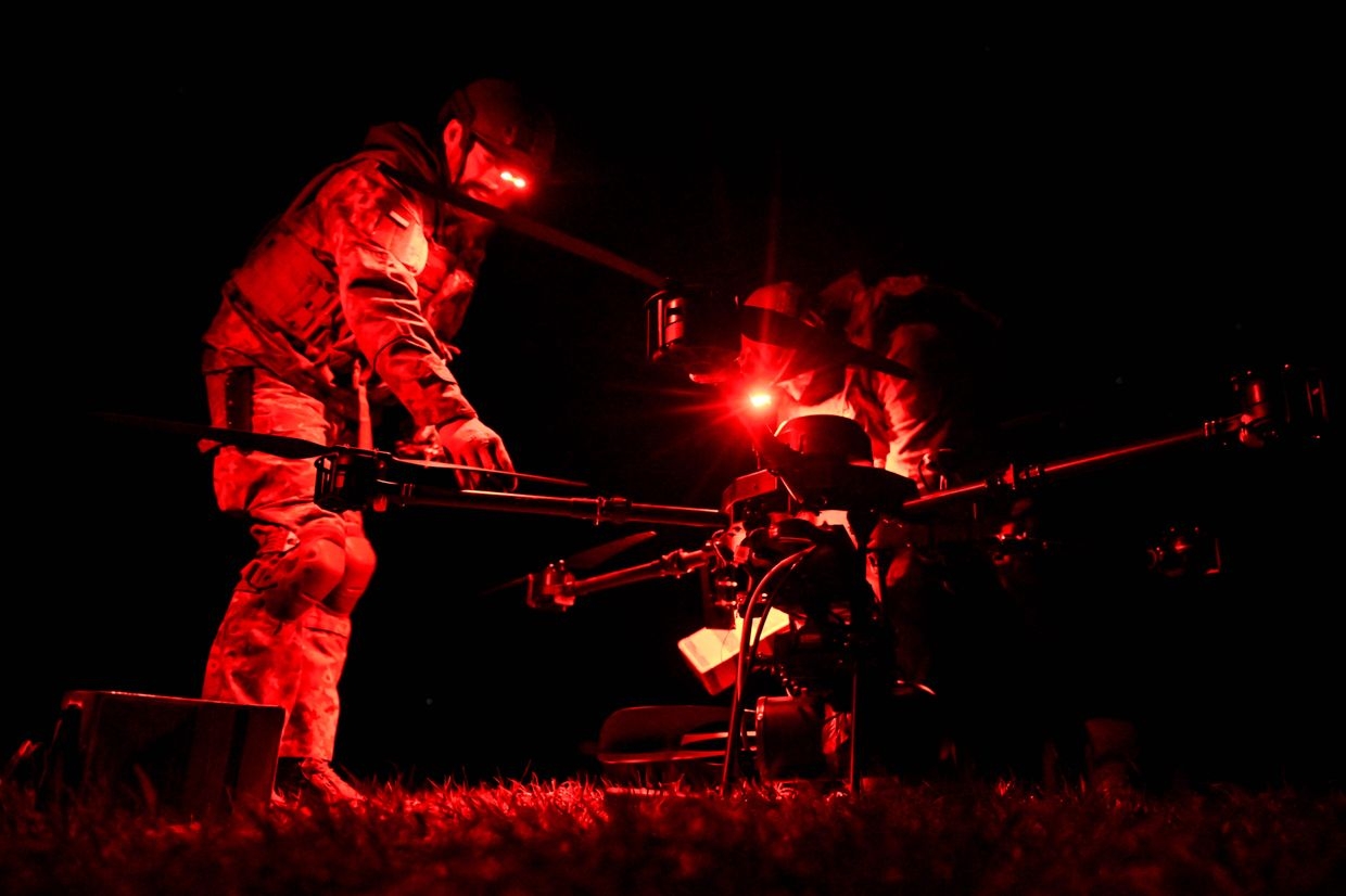 Soldiers of a drone platoon from the 110th Territorial Defence Brigade launch a Vampire heavy bomber drone in Zaporizhzhia Oblast, Ukraine, on April 28, 2025.