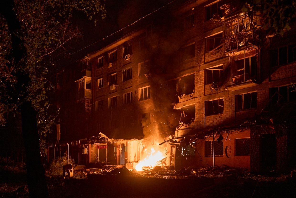 A damaged civilian home burns in Kyiv, Ukraine, on July 4, 2025, after being hit by a kamikaze drone during a mass drone and missile attack by Russia.