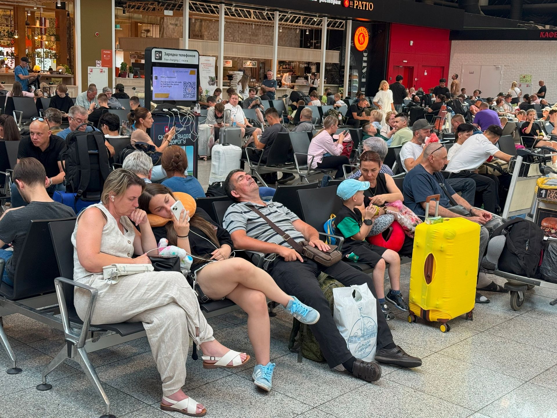 People wait for their flights at Sheremetyevo International Airport on the outskirts of Moscow, Russia, on July 28, 2025. 