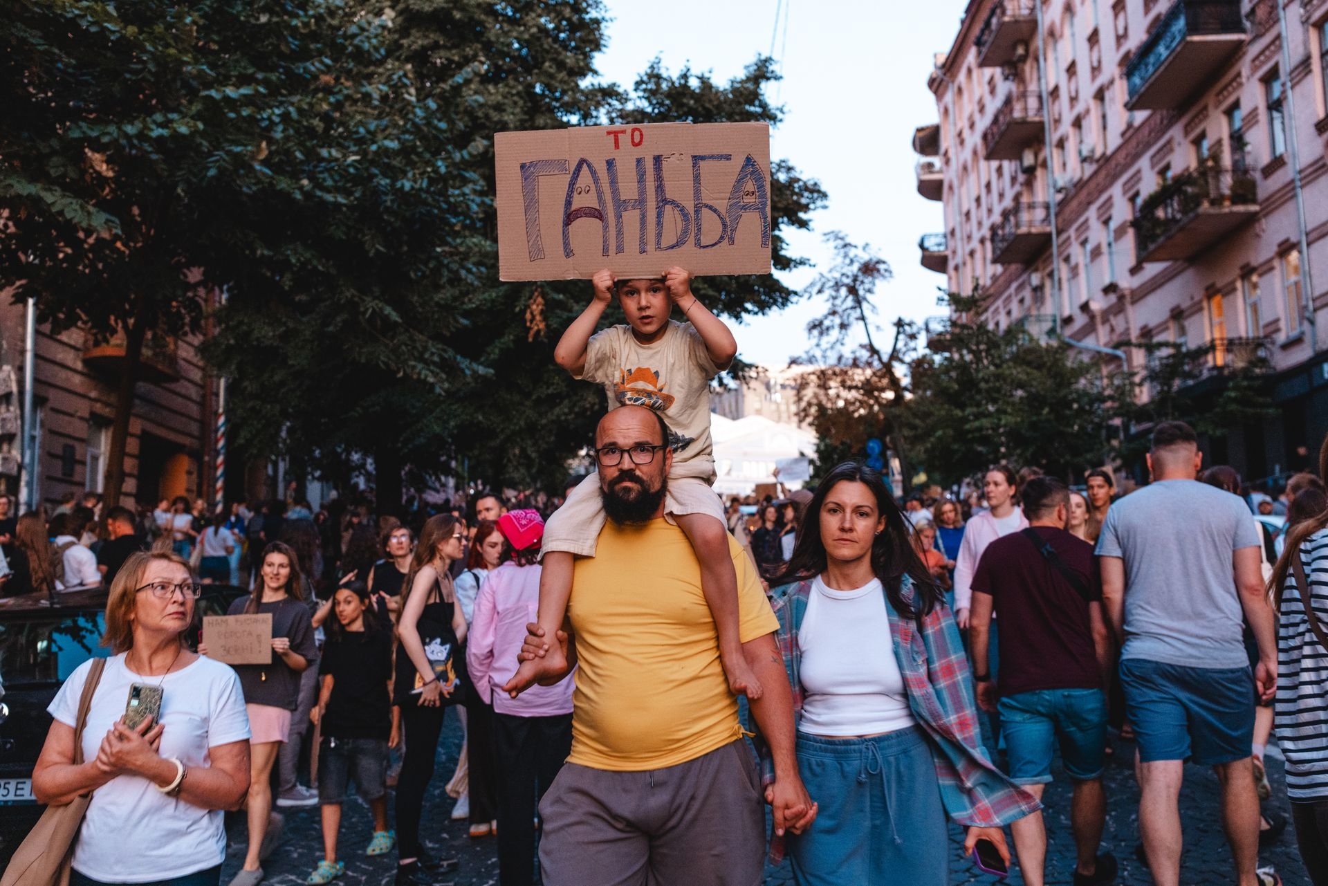 Protesters hold placards during a rally in Kyiv, Ukraine, on July 23, 2025