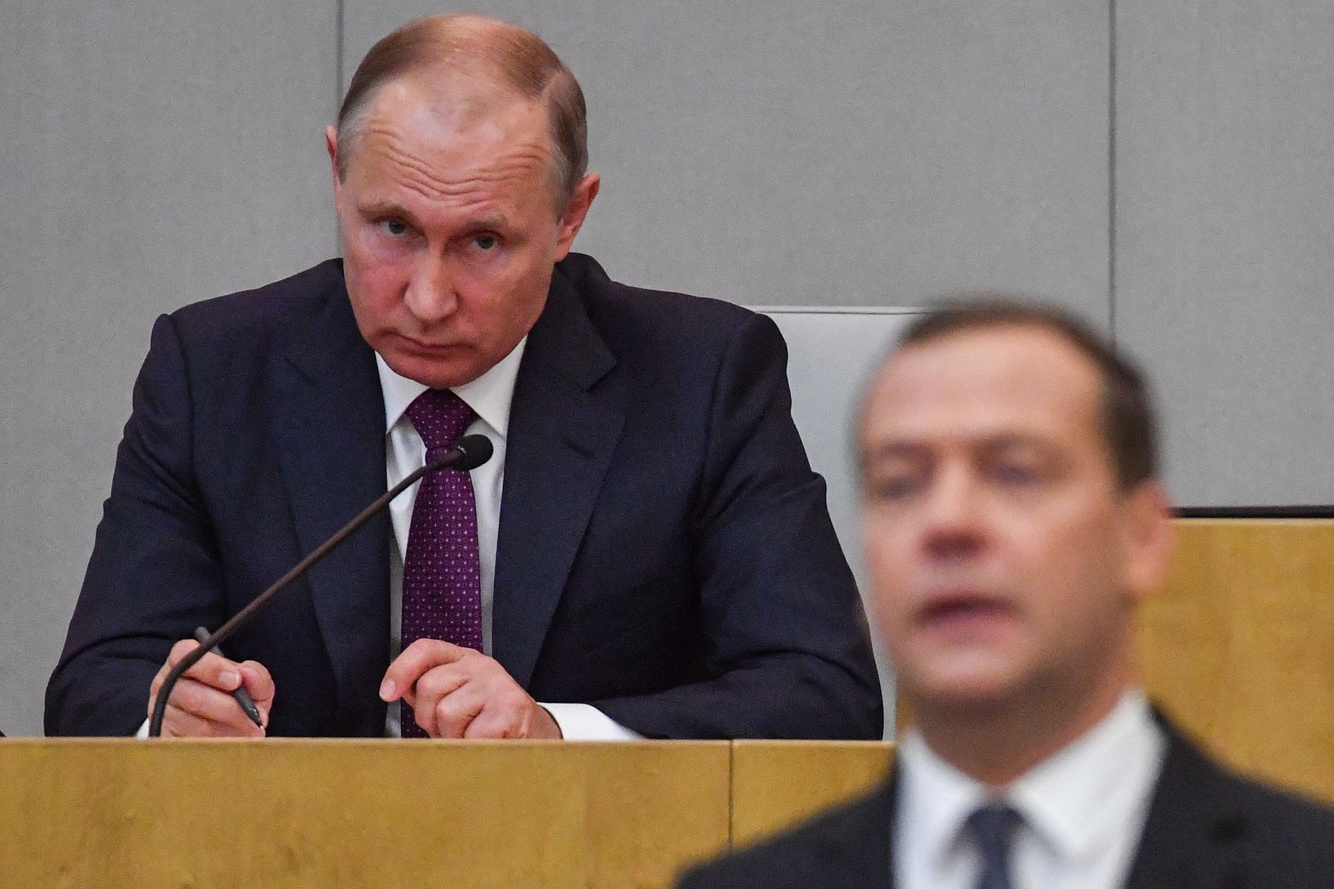 Then-acting Prime Minister Dmitry Medvedev and President Vladimir Putin attend a session of the State Duma in Moscow, Russia, on May 8, 2018.