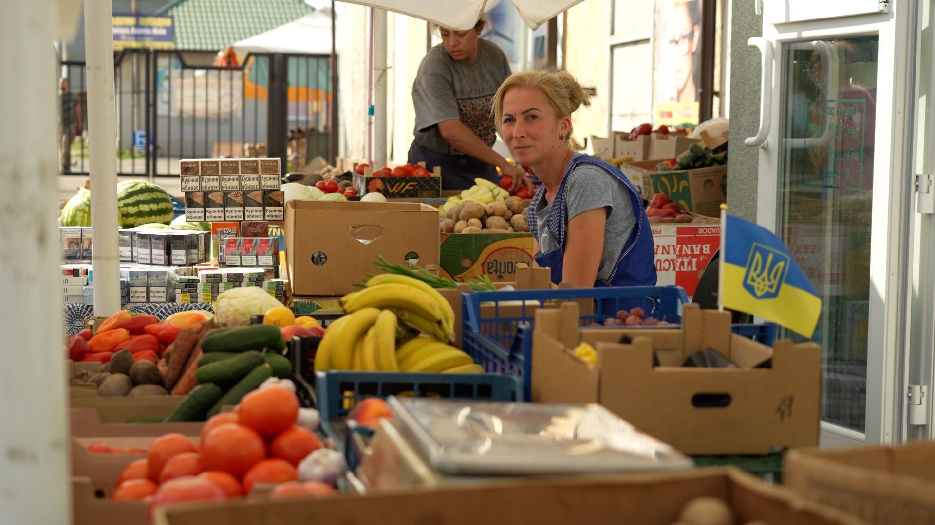 Fruit vendor Lidia sits by her stall at the corner of the market in Pokrovsk, Donetsk Oblast, Ukraine, on Sept. 9, 2024.