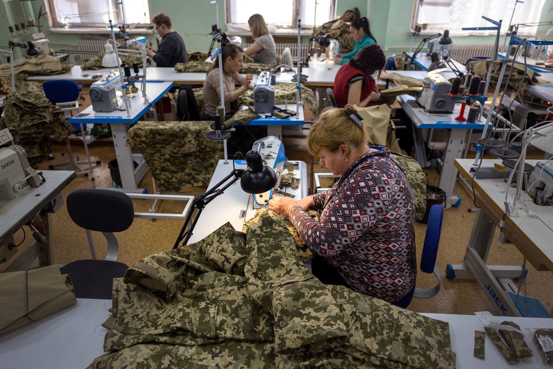 Workers sew uniforms and material for flak jackets at a military clothing factory in Kryvyi Rih, Ukraine, on May 5, 2022.