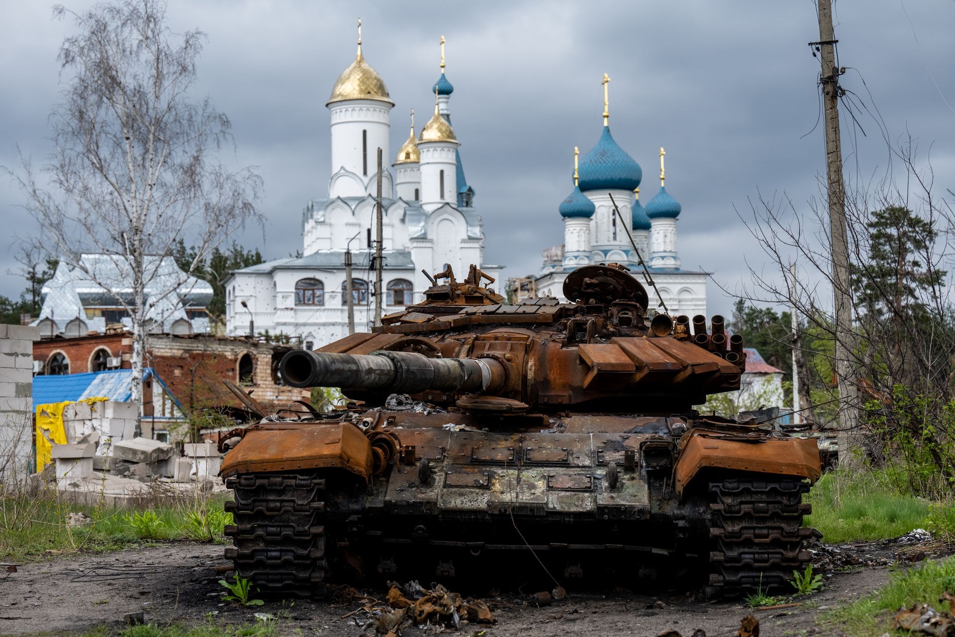A destroyed Russian tank near an Orthodox church (Moscow Patriarchate), in Sviatohirsk, Ukraine, on April 22, 2023. 