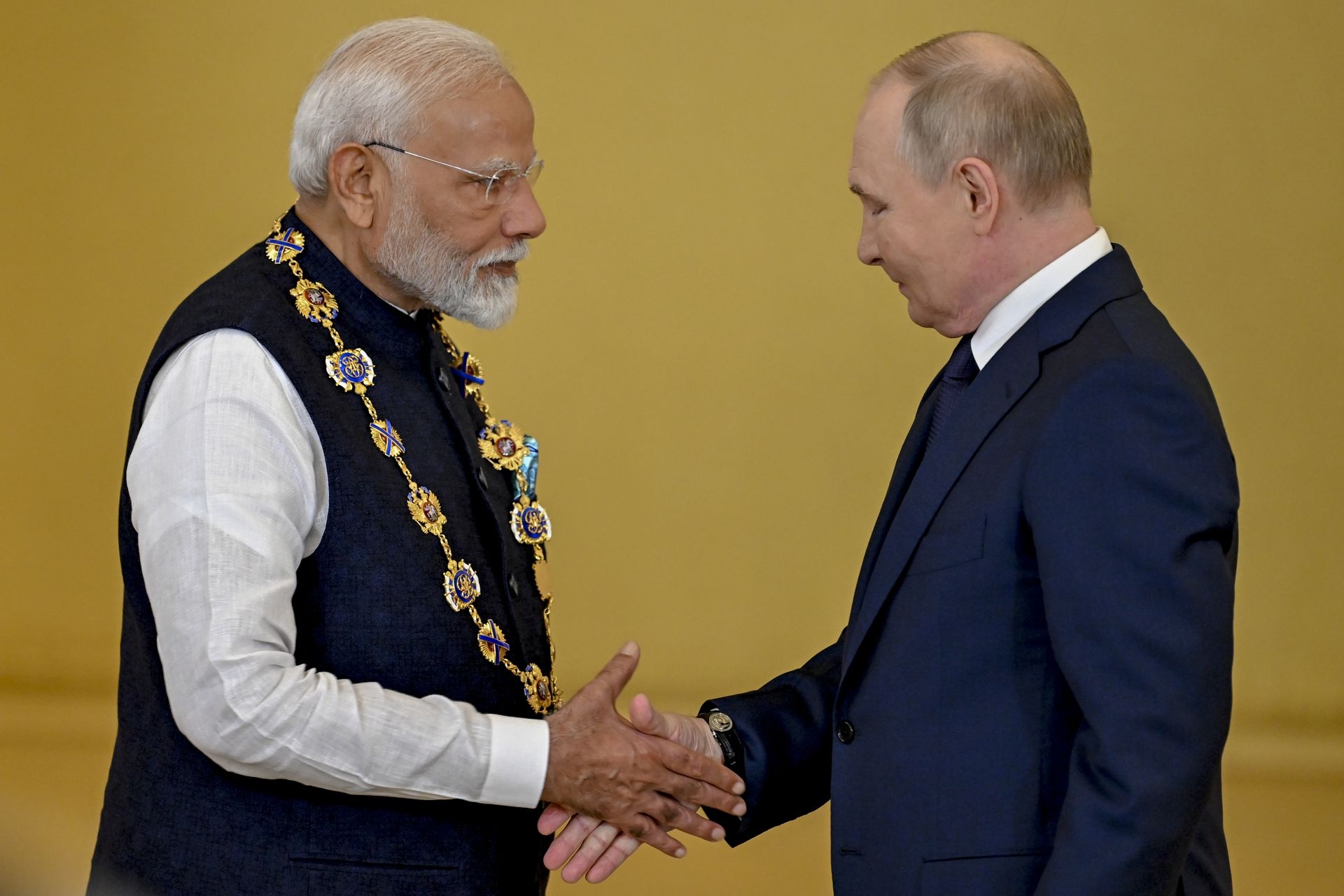 Russian President Vladimir Putin (R) awards the Order of St. Andrew to Indian Prime Minister Narendra Modi (L) for his contributions to relations between the two countries in Moscow, Russia, on July 9, 2024