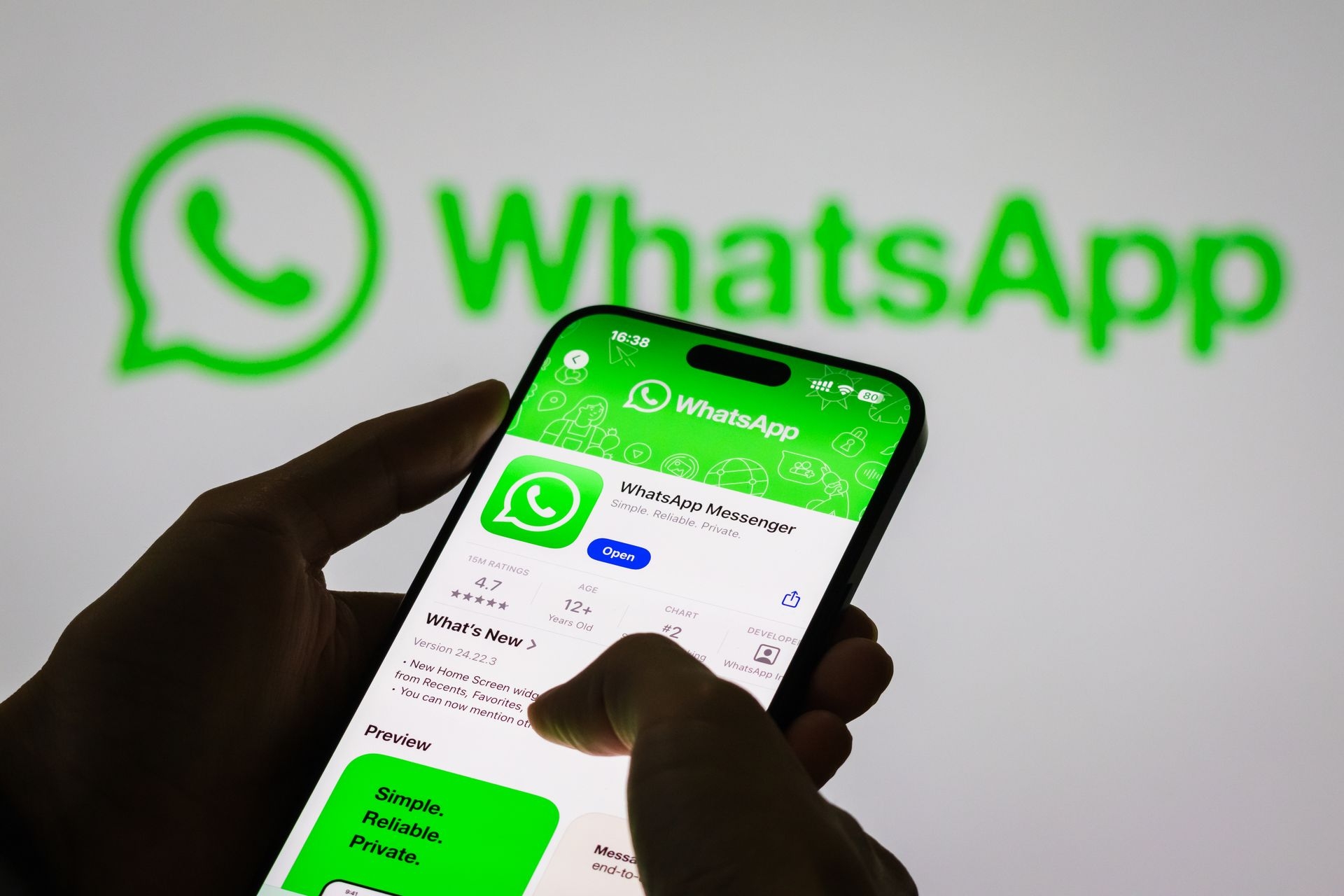 A person holds a smartphone displaying the WhatsApp app page in Chongqing, China, on Nov. 6, 2024.
