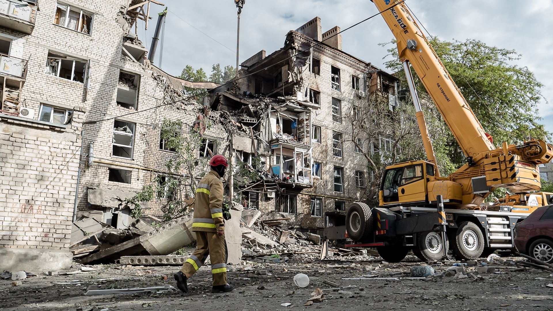 Rescuers work at the site of a Russian drone strike on a residential building in Mykolaiv, Ukraine, on May 25, 2025.