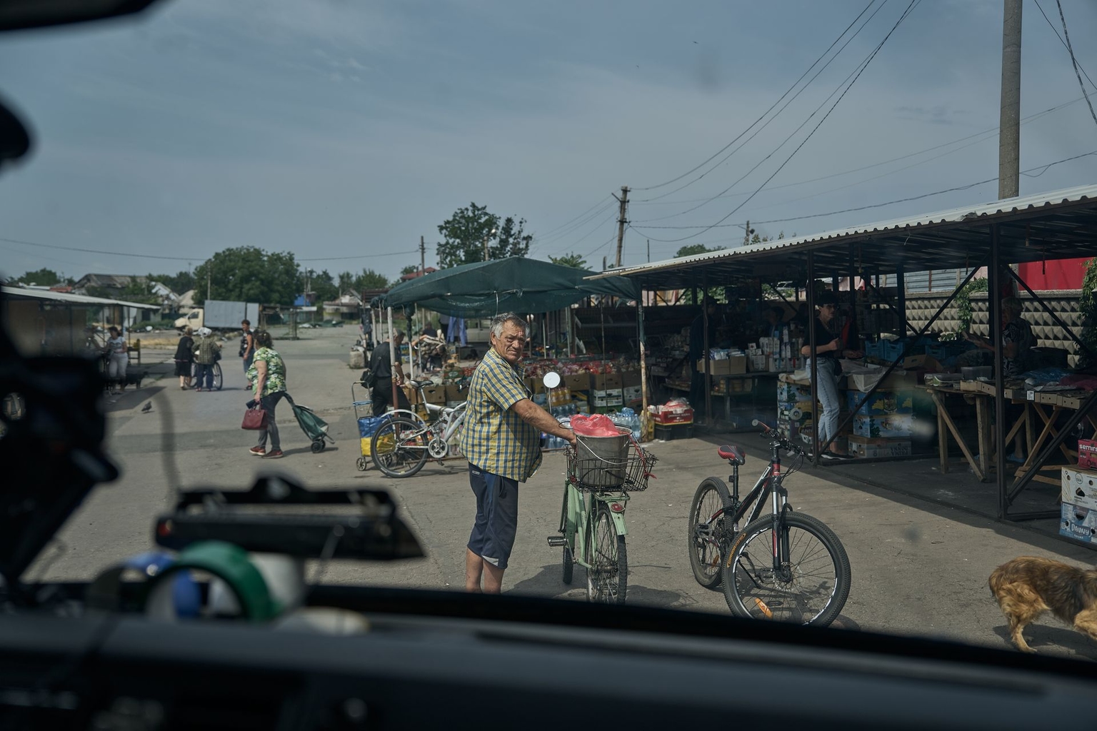 People gather at the last market in Pokrovsk, Donetsk Oblast, Ukraine, on June 19, 2025. 