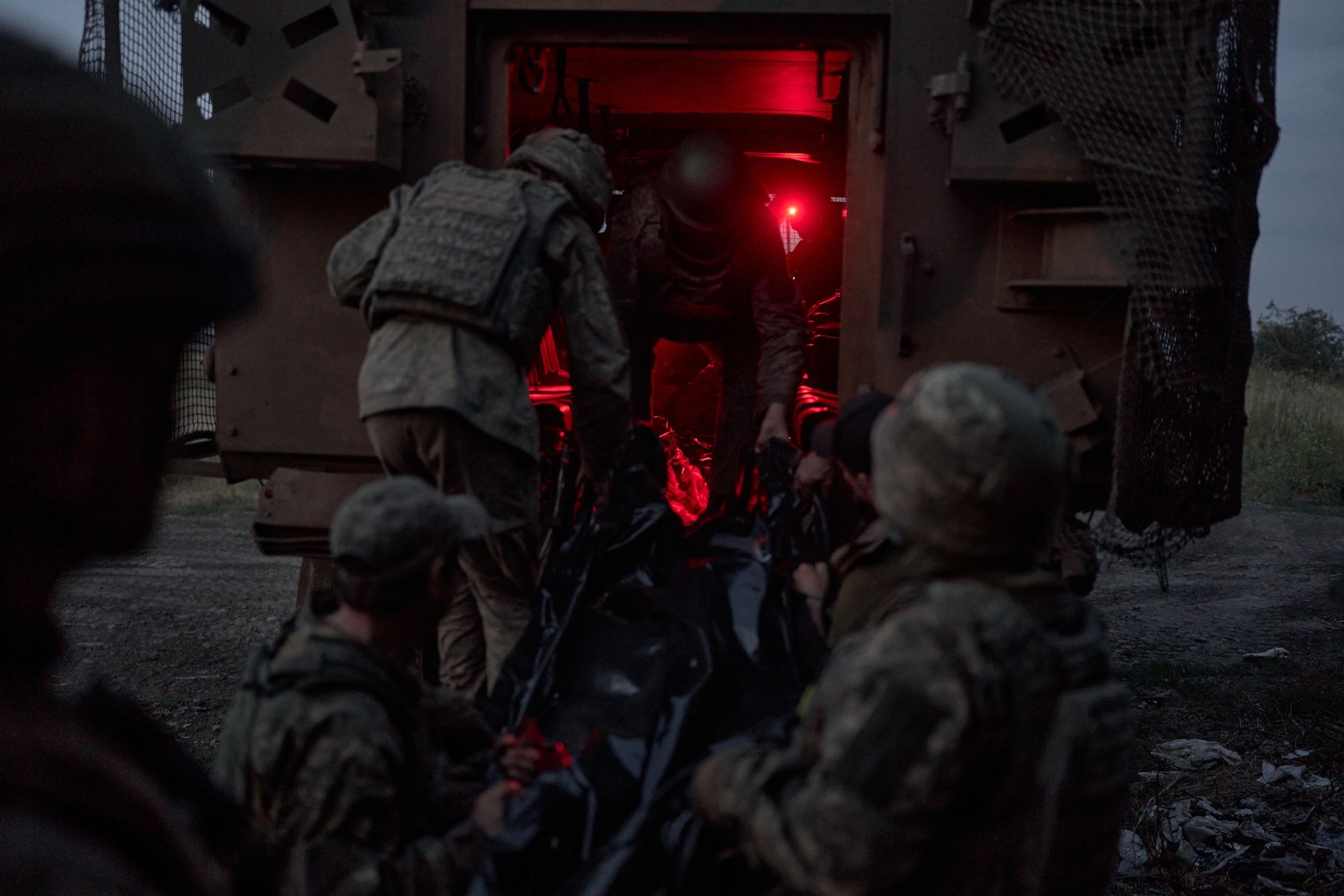 A deceased soldier is evacuated from an infantry position on the border between Donetsk and Dnipropetrovsk oblasts, Ukraine, on July 21, 2025.