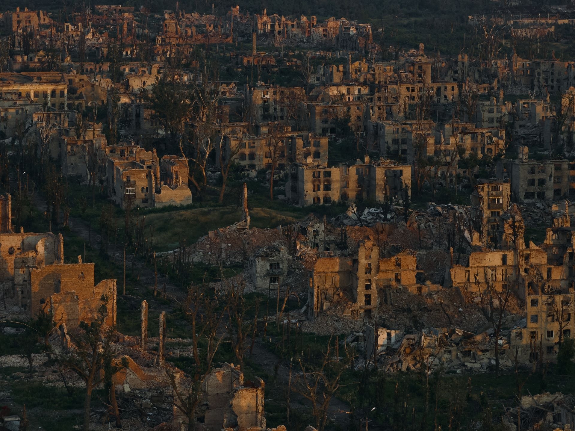 In this aerial view photo, the ruins of destroyed buildings are seen at dawn in Chasiv Yar, Donetsk Oblast, Ukraine, on July 24, 2025. 