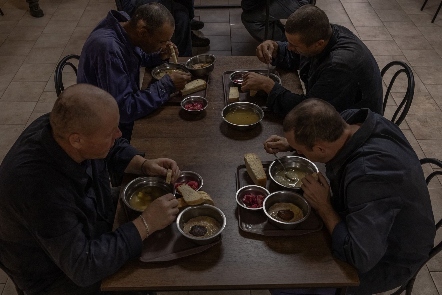 Russian prisoners of war have lunch at a camp for Russian POWs in western Ukraine on Sept. 19, 2023. 