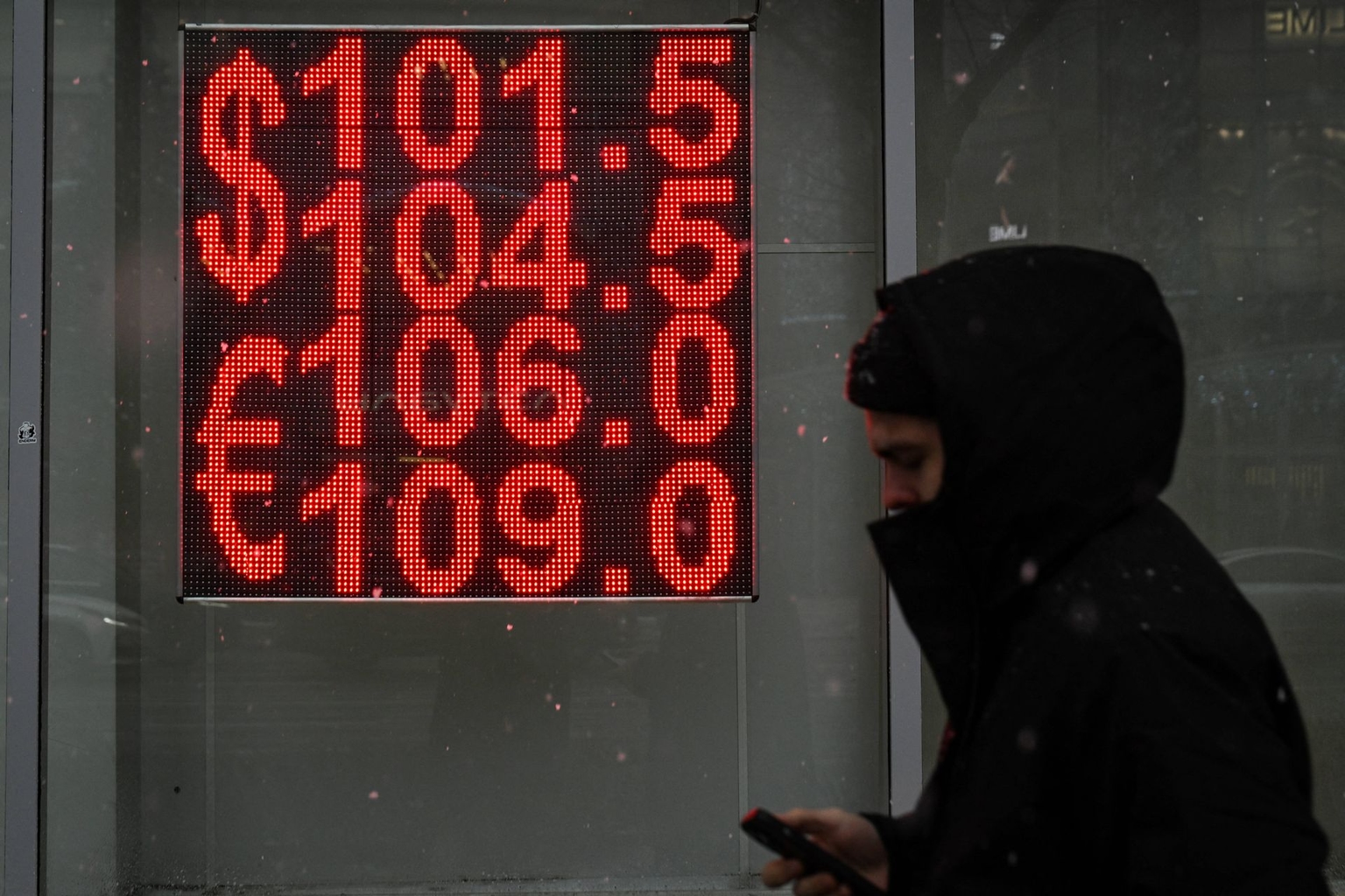 A man walks past a currency exchange office in Moscow, Russia, on Nov. 23, 2024. 
