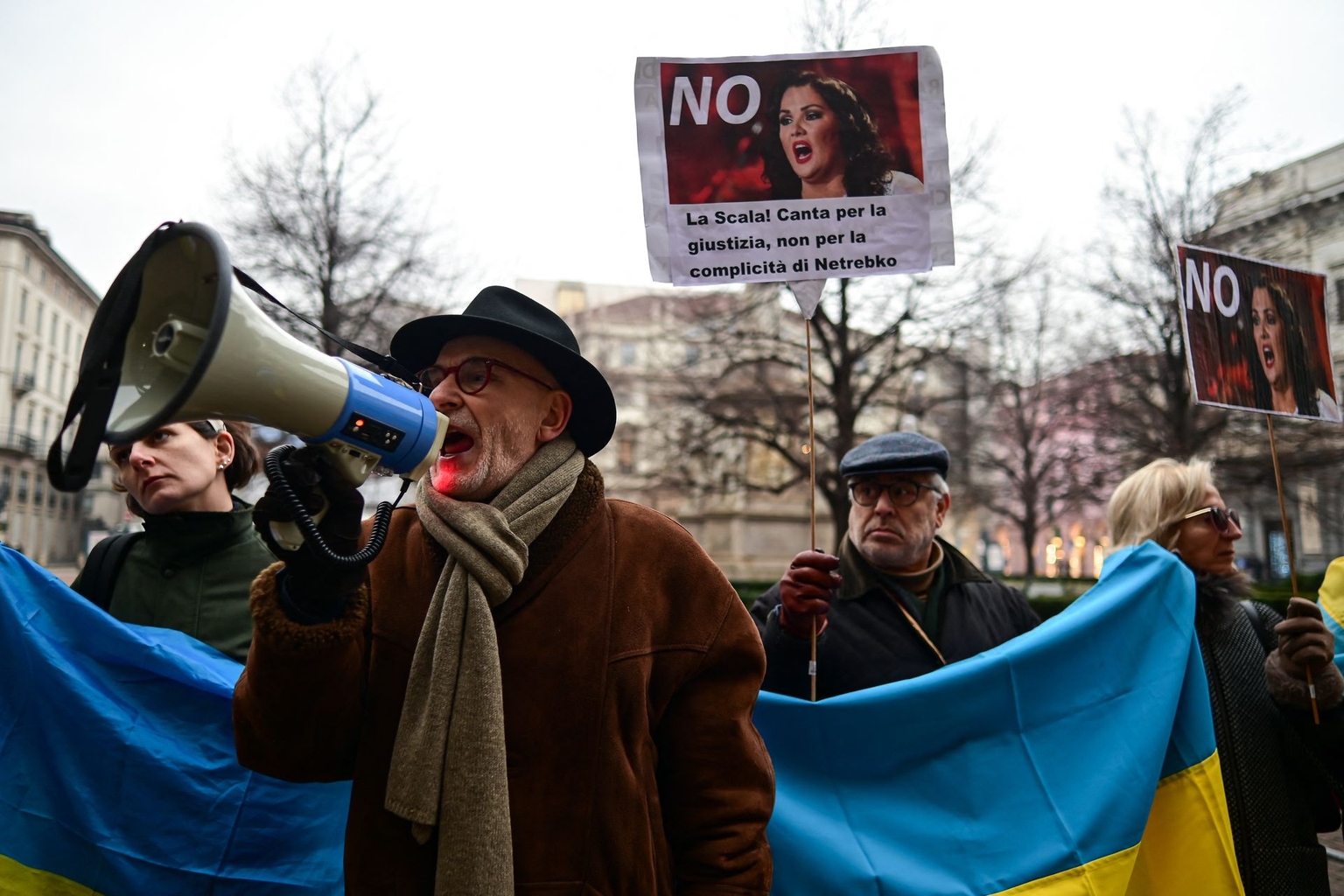 People protest against the presence of soprano Anna Netrebko ahead of the season-opening gala at La Scala Opera House in Milan, Italy, on Dec. 7, 2024.