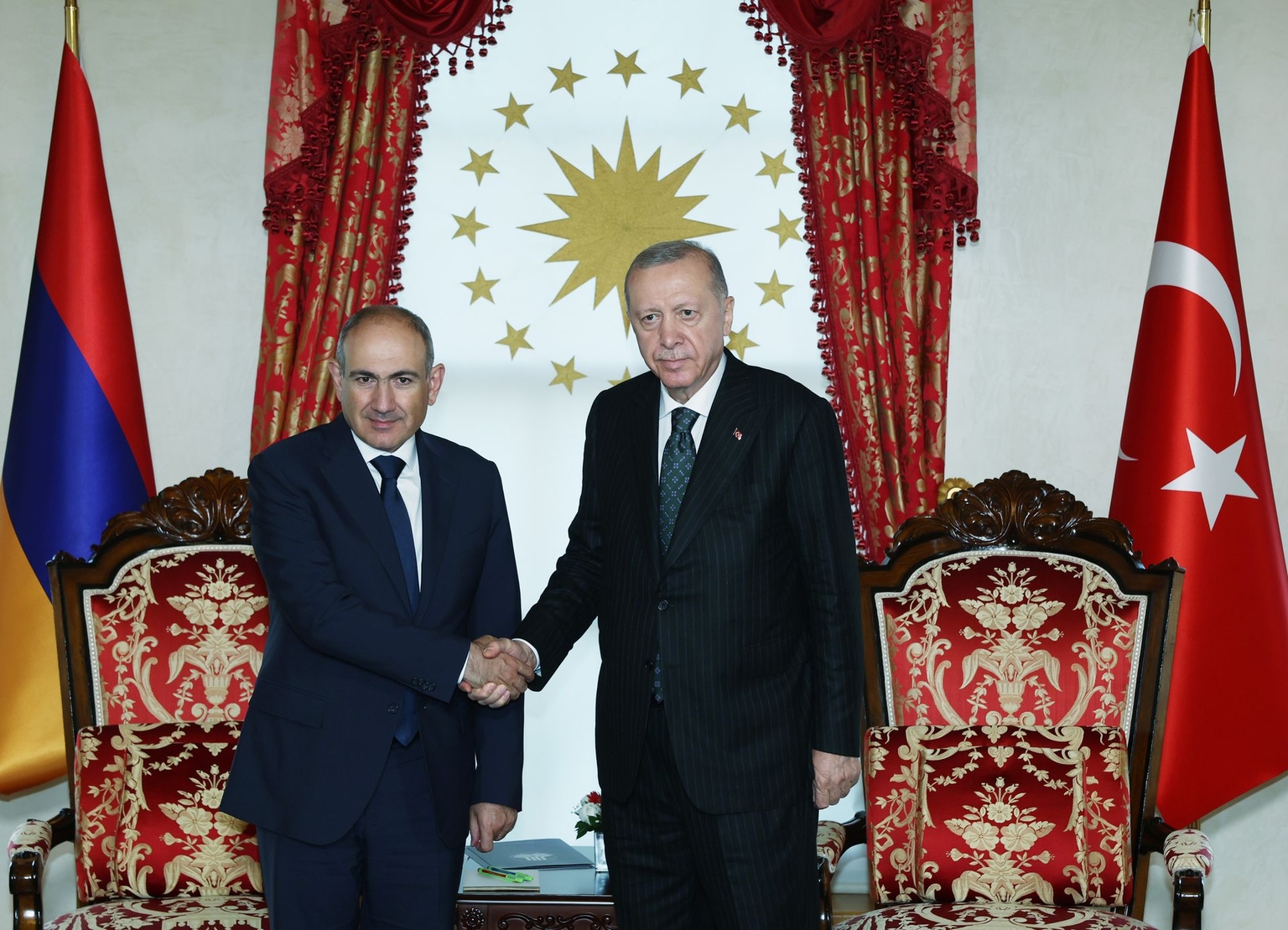 Turkish President Recep Tayyip Erdogan (R) receives Armenian Prime Minister Nikol Pashinyan (L) at the Dolmabahce Presidential Office in Istanbul, Türkiye, on June 20, 2025. 
