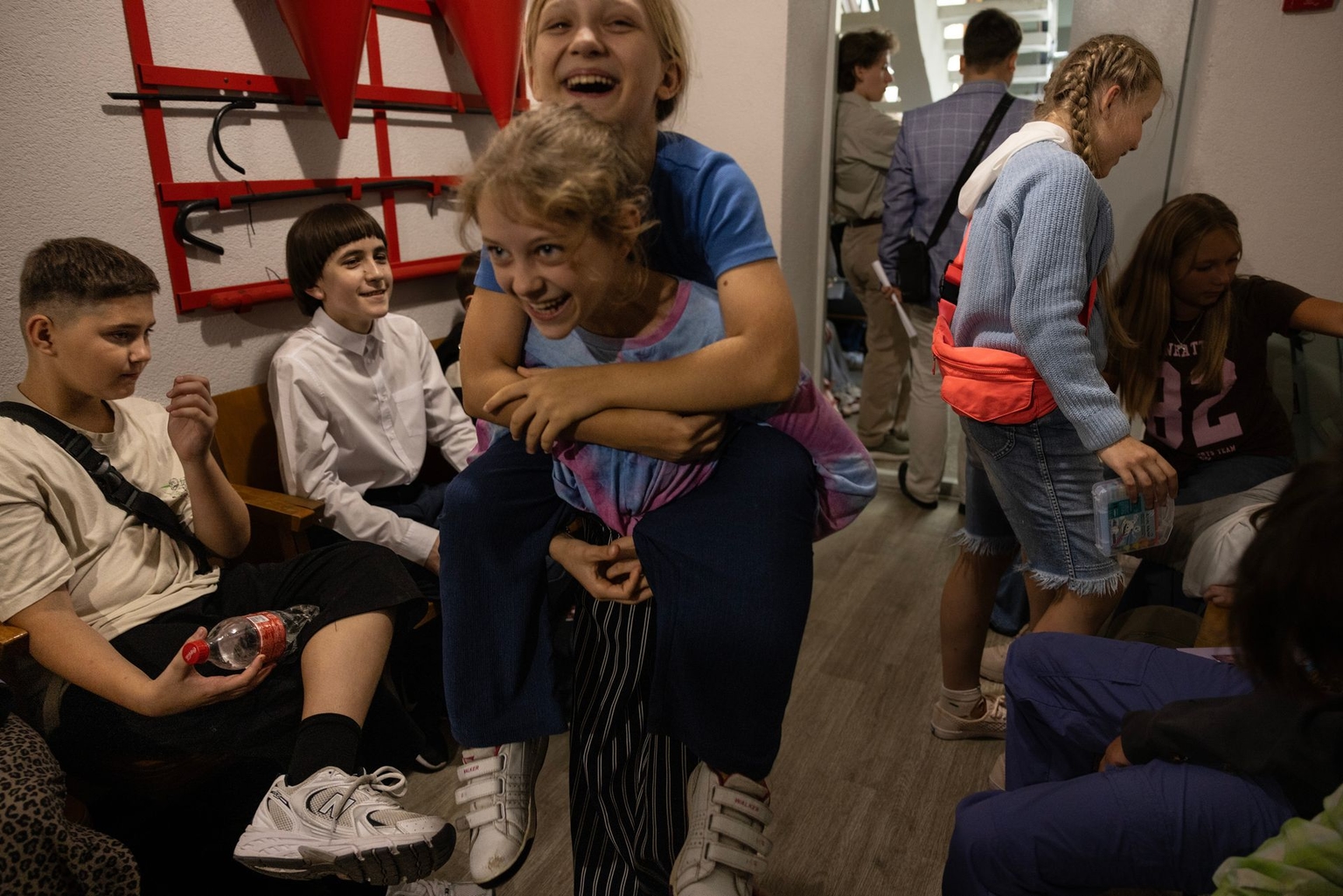Students play in a shelter at the Kyiv State Music Lyceum M.V. Lysenko on the second day of classes during an air alert that lasted over three hours in Kyiv, Ukraine, on Sept. 2, 2025. 