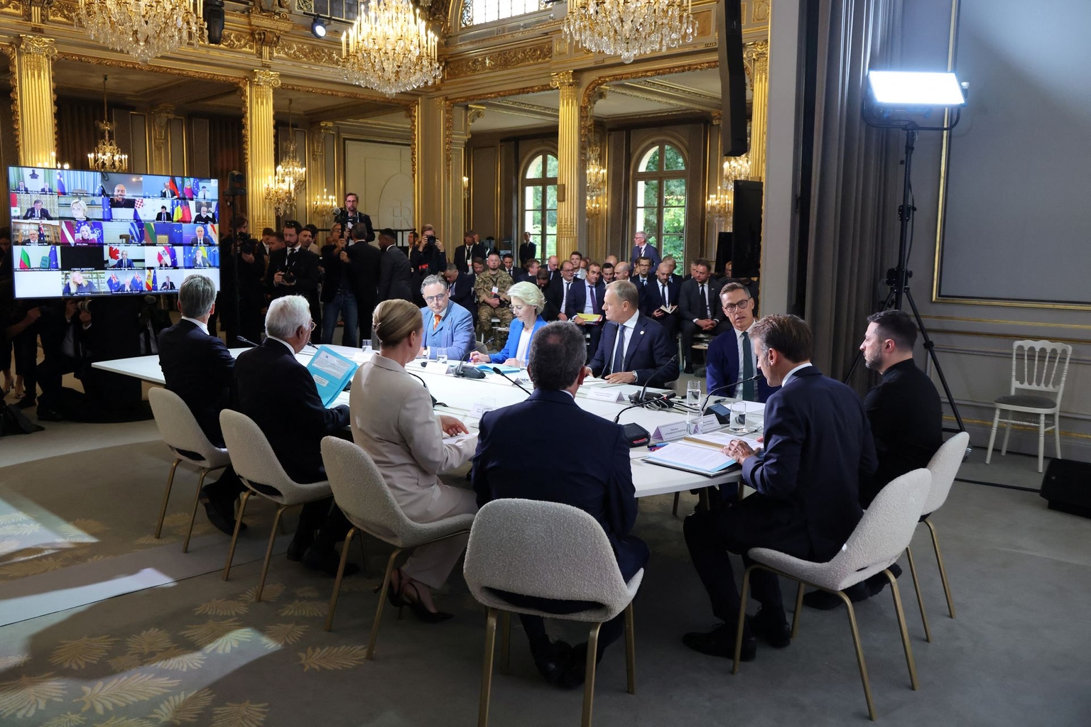 France’s President Emmanuel Macron (2nd R) and President Volodymyr Zelensky (R) lead a meeting with international leaders during the Coalition of the Willing Summit at the Élysée Palace in Paris, France, on Sept. 4, 2025. 