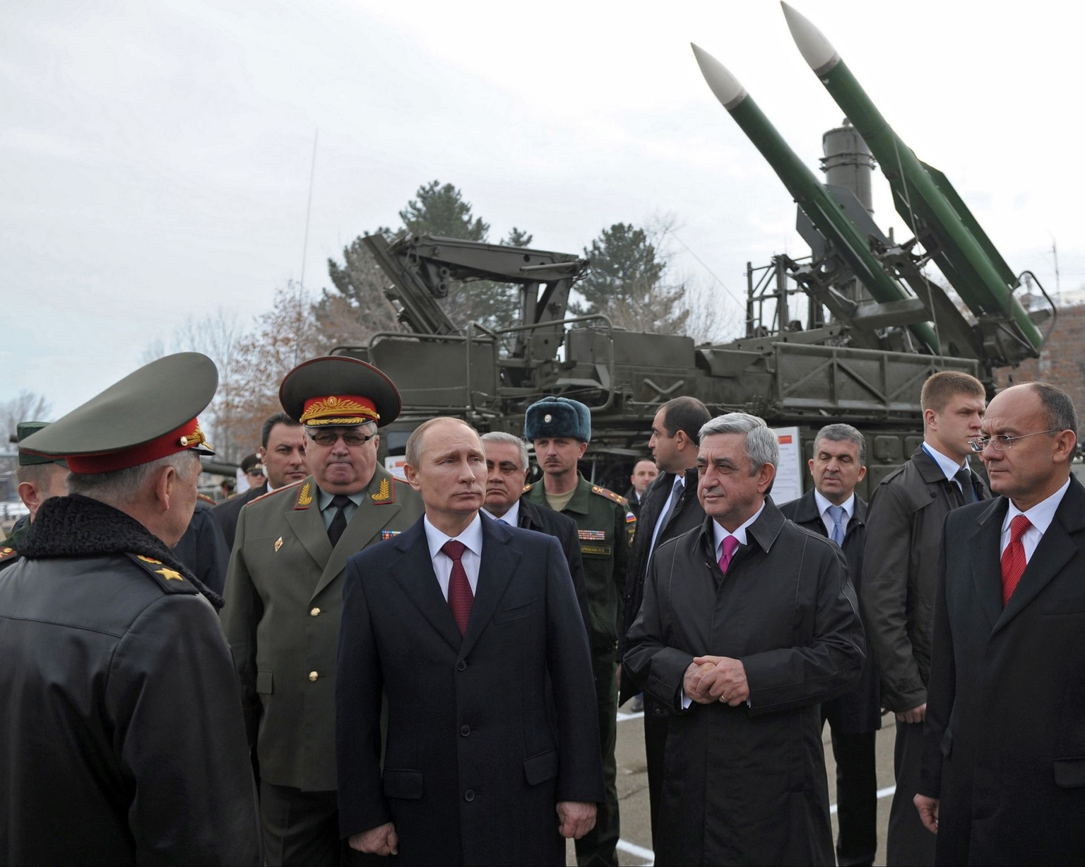 Russian President Vladimir Putin (3rd L) and then-Armenian President Serzh Sargsyan (3rd R) visit the Russian military base in Gyumri, Armenia, on Dec. 2, 2013.