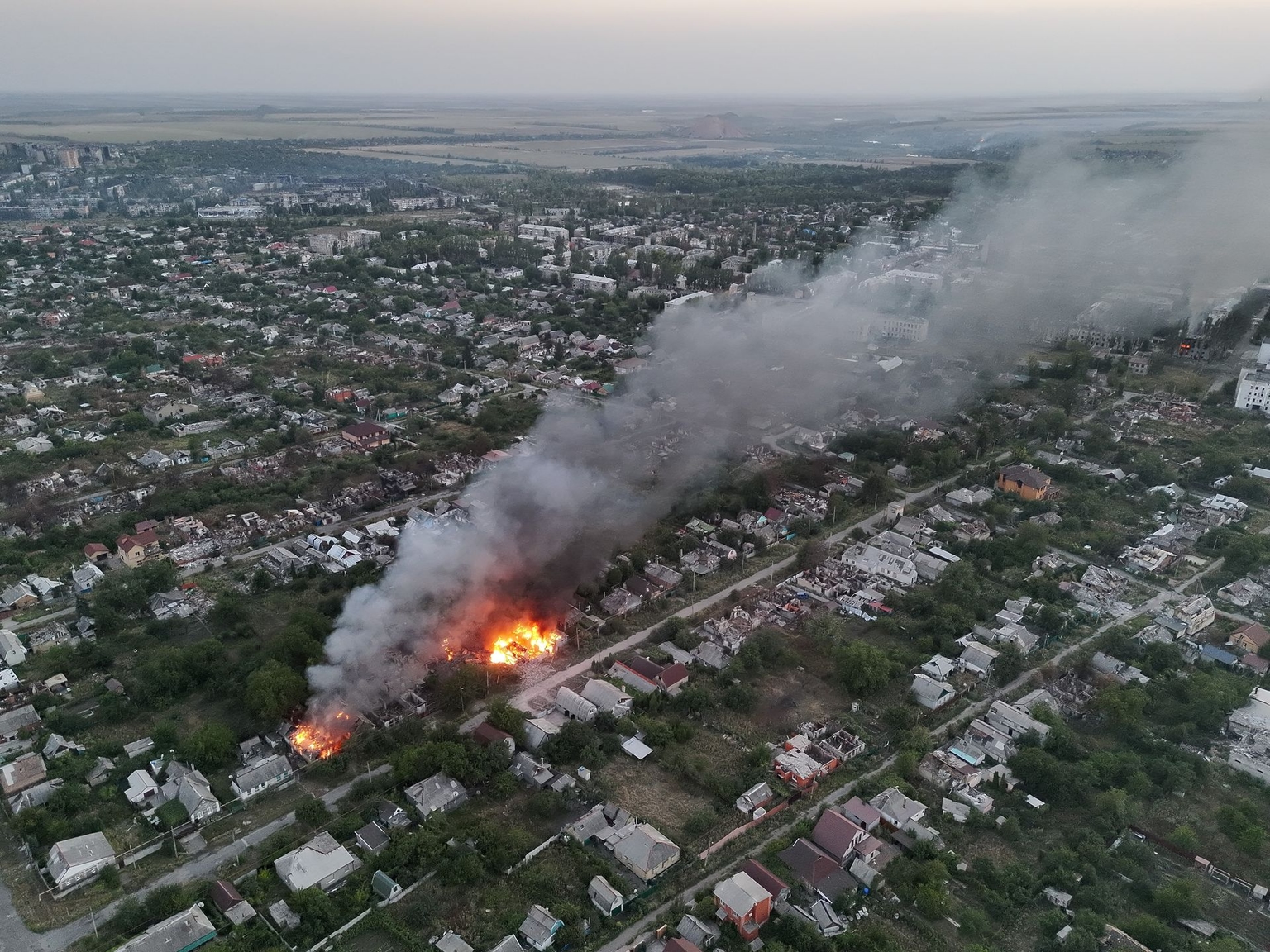 Destroyed residential houses burn following shelling by Russian forces in Pokrovsk, Donetsk Oblast, Ukraine, on Aug. 31, 2025.