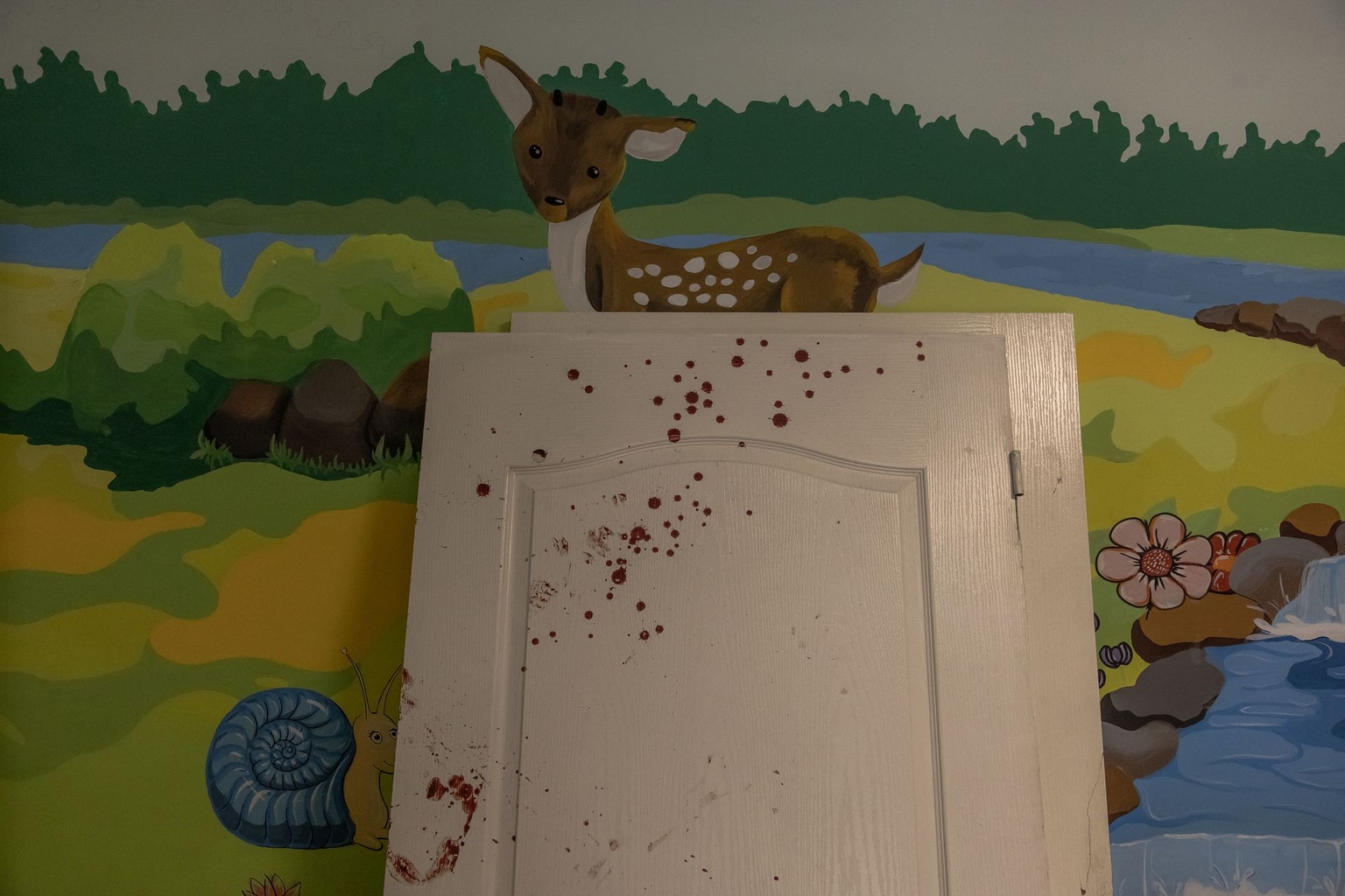 Blood stains a damaged door inside a heavily damaged building of Ohmatdyt Children’s Hospital following a Russian missile attack in Kyiv, Ukraine, on July 8, 2024. 