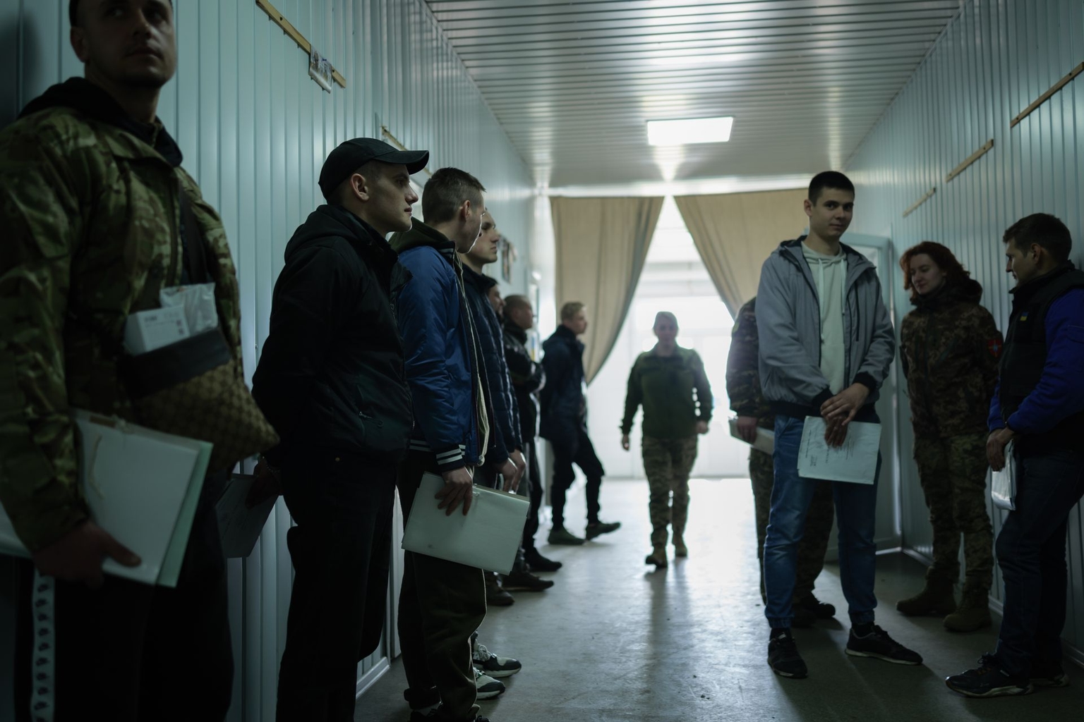 Volunteers attend a conscription point to sign contracts with the Ukrainian army in Ukraine on March 26, 2024. 