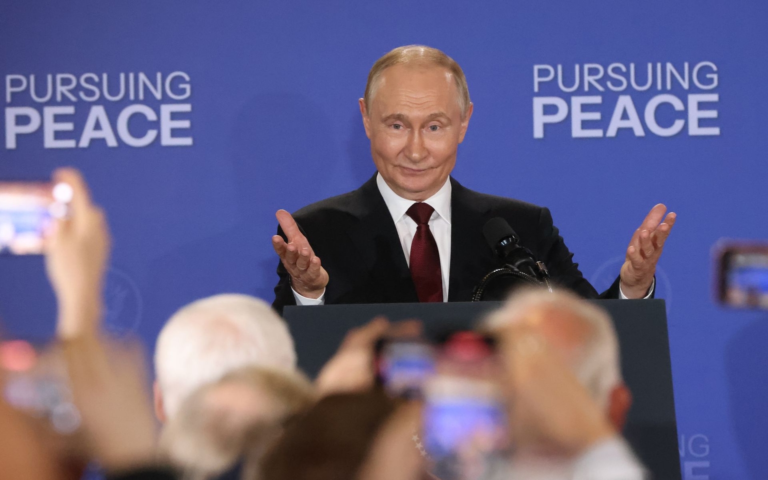 Putin gestures during a joint press conference in Anchorage, Alaska, on Aug. 15, 2025.