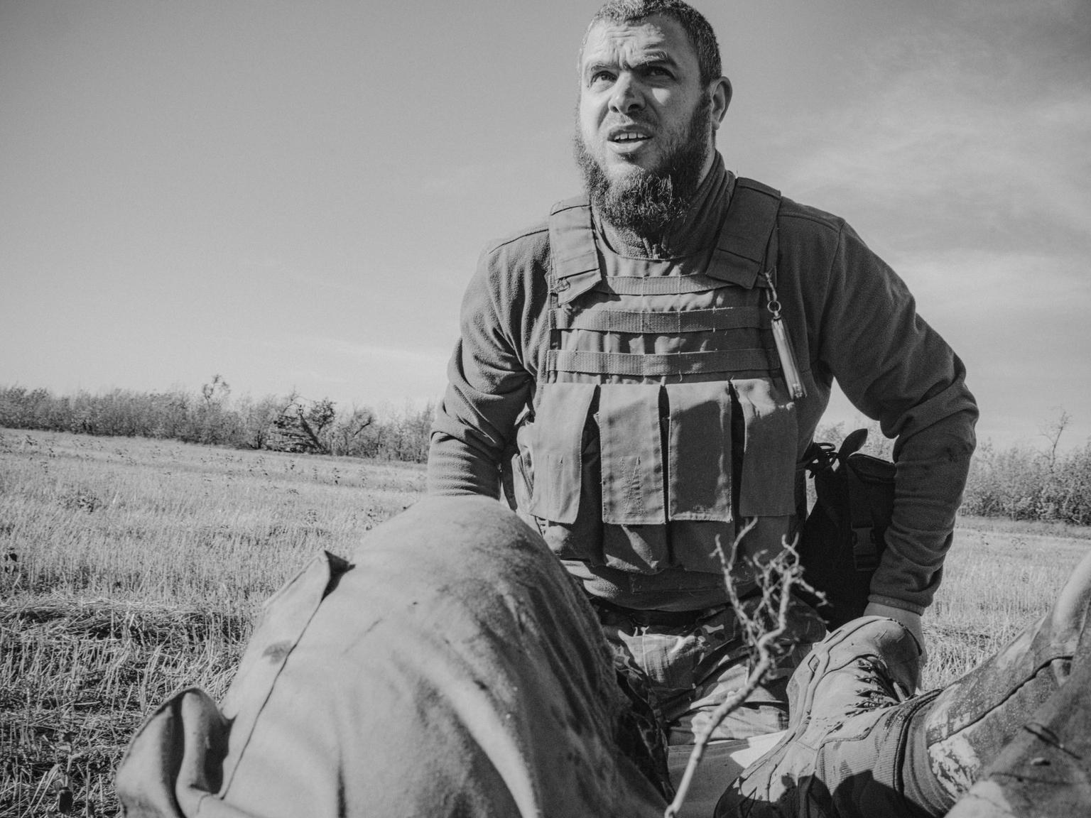 Soldier Ruslan carries wounded reporter George Ivanchenko on a stretcher after a Russian FPV drone strike near Druzhkivka.